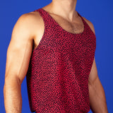 muscular man wearing a turing pattern gym tank