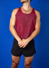 muscular man wearing a turing pattern gym tank