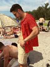 zeidmoon on a beach in a red 90's pattern vintage style hawaiian shirt