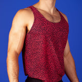 muscular man wearing a turing pattern gym tank