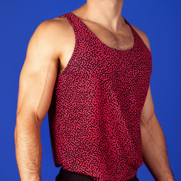 muscular man wearing a turing pattern gym tank