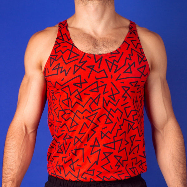 muscular man wearing a red gym tank with a zig zag pattern