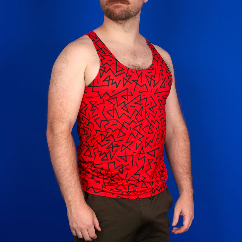 man wearing a red zigzag pattern gym tank top